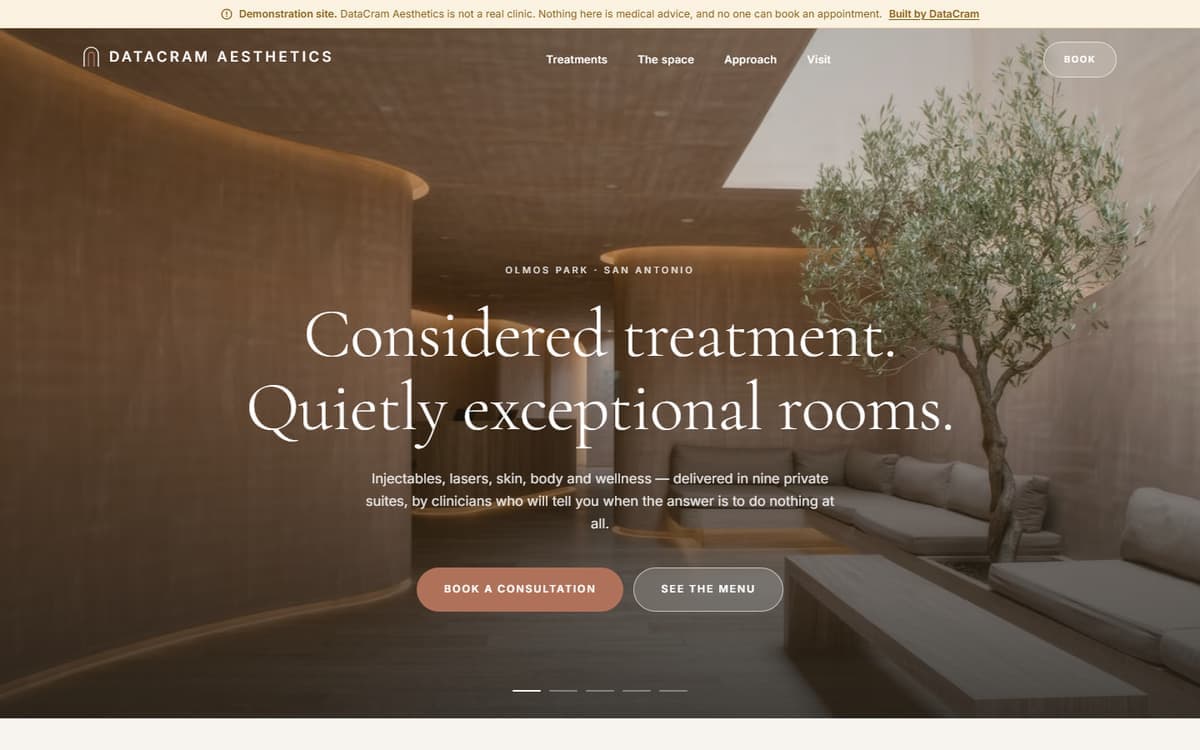 The DataCram Aesthetics demo site: a full-bleed photograph of a warm minimal spa lounge with a centered serif headline over it, on a slow five-image rotation.