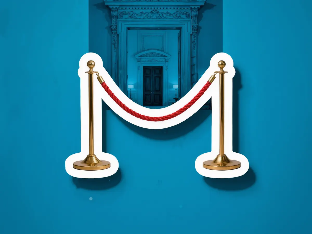 Two brass stanchions joined by a red velvet rope, over a blue photograph of a grand doorway.