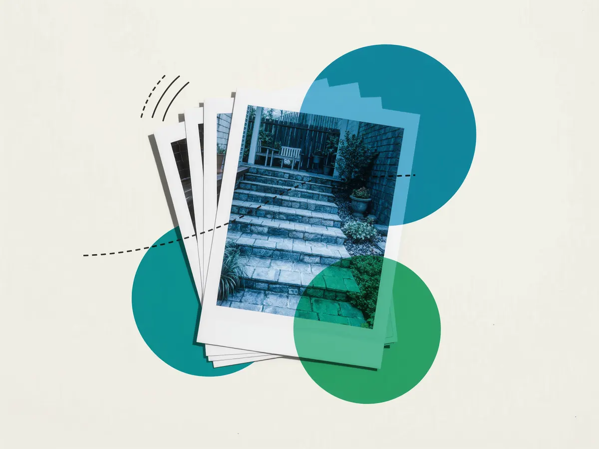 A fanned stack of instant photo prints of a stone garden patio.