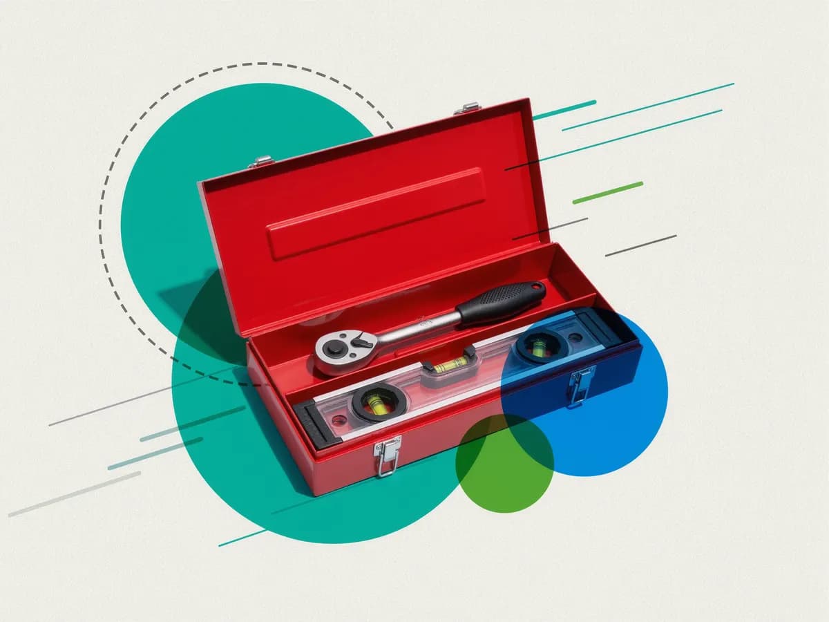 An open red toolbox with a socket wrench and a spirit level, set over teal and green circles.
